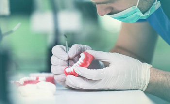 Lab technician creating dentures