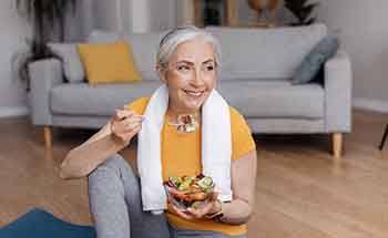 Dental implants patient in Woodstock eating healthy after workout