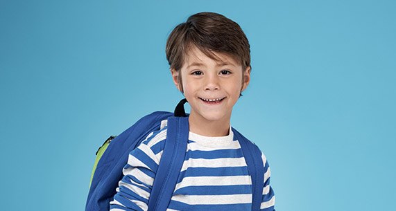 Young smiling boy with backpack