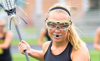 Girl wearing athletic mouthguard